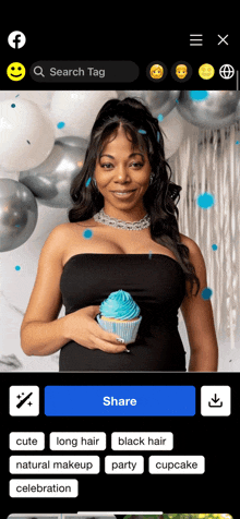 a woman in a black dress is holding a blue cupcake in front of balloons