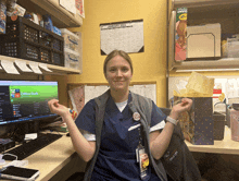 a woman sitting at a desk in front of a computer that says office girls on the screen