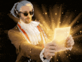 a man wearing headphones and sunglasses is holding a piece of paper with a light coming out of it