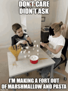 a boy and a woman are making marshmallows and pasta