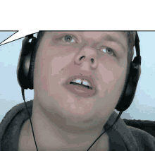 a man wearing headphones with a speech bubble behind him