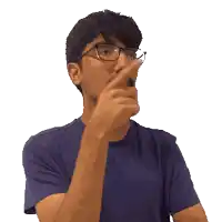 a man wearing glasses and a blue shirt is pointing to his chin