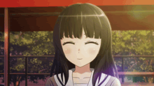 a girl with black hair and a white shirt is smiling