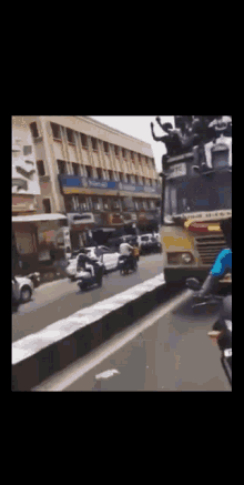 a group of people sitting on top of a bus with a sign that says ' tfc ' on it