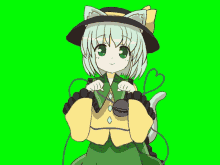 a girl with a cat ear on her hat stands in front of a green screen