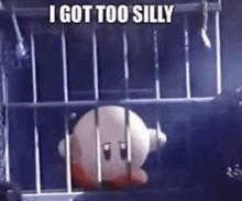 kirby is sitting in a cage with the words `` i got too silly '' written above him .