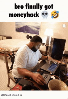 a man sitting at a desk using a laptop with the words bro finally got moneyhack at the top