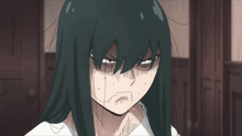 a girl with long black hair has a tear coming out of her nose
