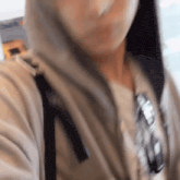 a close up of a person wearing a hoodie