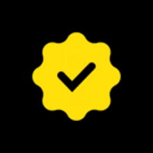 a yellow circle with a black check mark inside of it .