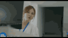 a woman in a white lab coat is standing in front of a computer screen with youtube.com/faptivi on the bottom right