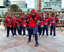 a group of men wearing red russia shirts