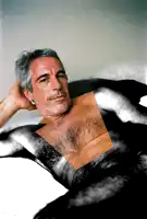 a man with gray hair and a mustache is laying down
