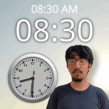 a man with glasses stands in front of a clock that reads 8:30 am