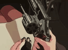 a person is holding a gun in their hands and looking at the barrel .