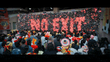 a crowd of people gathered in front of a wall that says russia on it