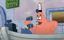 patrick star from spongebob squarepants is talking on a cell phone .