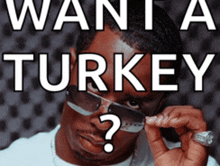 a man wearing sunglasses has a question mark on his forehead in front of a sign that says want a turkey