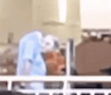 a blurry picture of a person in a hospital bed with a nurse .