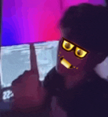 a man wearing sunglasses is giving the middle finger in a blurry photo .