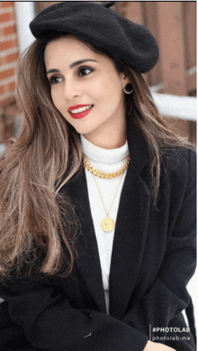 a woman wearing a black beret and a white turtleneck sweater