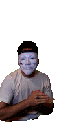 a man wearing a white anonymous mask with a x on his face