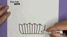 a person is drawing a tooth with a marker on a piece of paper