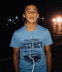 a young man wearing a t-shirt that says jeepney