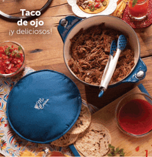 a pot of taco de ojo is sitting on a table