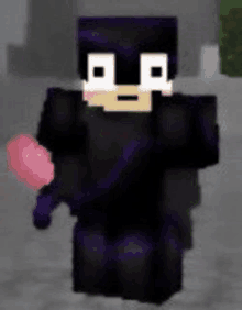 a minecraft character is holding a pink heart in his hands .