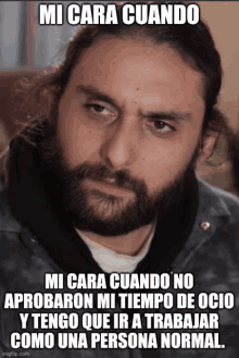 a man with long hair and a beard is making a funny face with a meme that says mi cara cuando