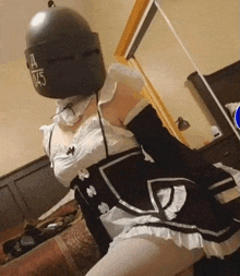 a woman in a maid costume has a helmet on her head with the number 0.45 on it