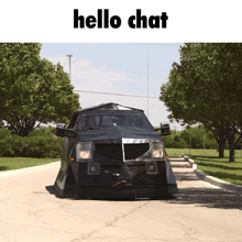 a black vehicle is driving down a road with the words hello chat above it
