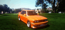 an orange car is parked on a grassy field