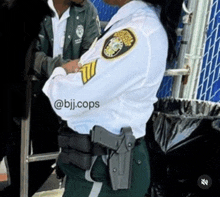 a female police officer with a gun in her holster