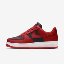 a pair of red and black nike air force 1 low sneakers