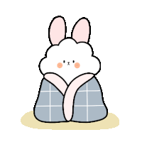 a cartoon rabbit is wrapped in a blanket .