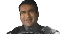 a man is smiling while wearing a jacket that says er