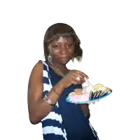a woman holding a plate of food with a fork