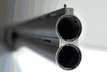 a shotgun has two barrels that are connected by a screw