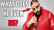 a man in a red jacket is holding a wine glass and the words what does he even do