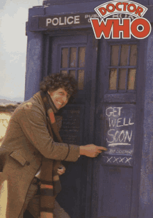 a man standing in front of a police box with doctor who written on it