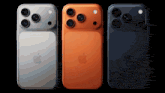three apple phones are lined up in a row