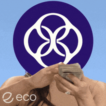 a woman holding a bunch of money in front of a purple circle with the word eco on it