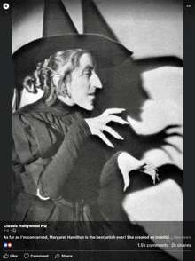 a black and white photo of margaret hamilton as the wicked witch