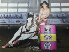 a woman in a bikini is riding a horse in front of a barrel that says sleezer s ranch