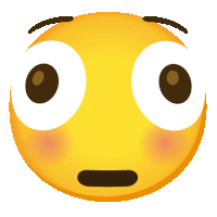 a yellow smiley face with big eyes and a surprised expression