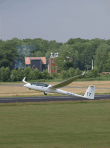 a plane with ph-1621 written on the tail is taking off