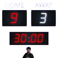 a scoreboard shows that the home team is currently leading the away team