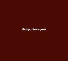 a red background with the words `` baby , i love you '' written in white letters .